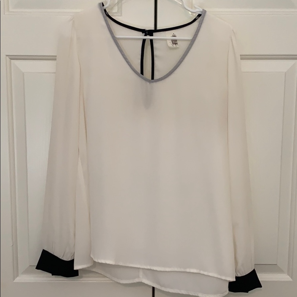 White blouse with black cuffs